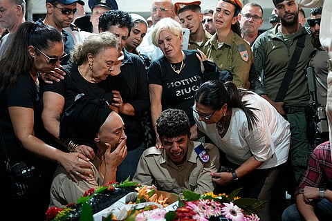 Middle East Tensions: Iris Shitrit, seated left, the mother and relatives mourn during his funeral 
